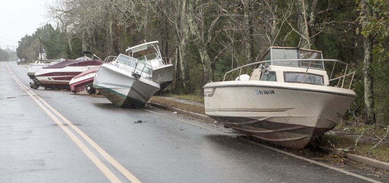 Power boats appear to be driving down the road after they were washed up from a nearby Marina in Tuckerton, N.J., Oct. 30, 2012 after Hurricane Sandy made landfall. UPI/John Anderson