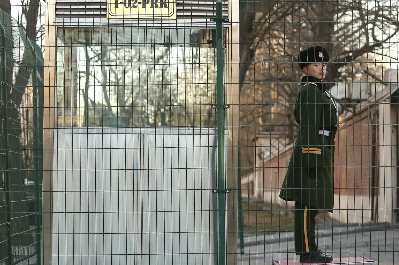 A Chinese soldier stands guard outside the North Korean embassy in Beijing. Kim Jong Nam, the older half-brother of Kim Jong Un, was living under Chinese protection before he was assassinated at an airport in Malaysia. Photo by Stephen Shaver/UPI