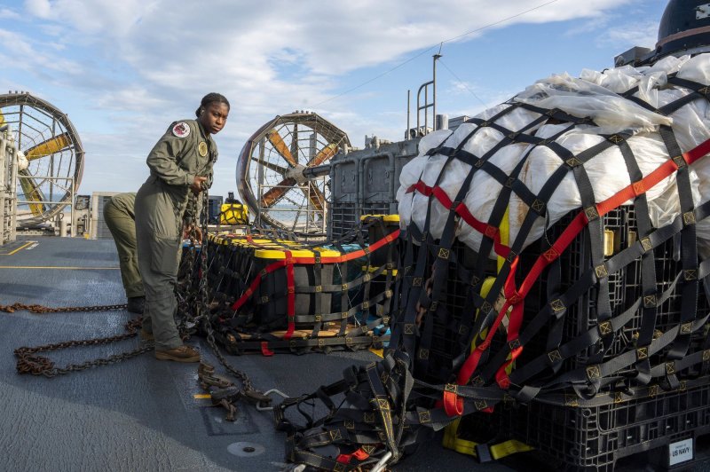 A Navy sailor assigned to Assault Craft Unit 4 prepares for transport debris from the Chinese balloon that was shot down over the Atlantic Ocean earlier this month. The U.S. military has downed three unidentified aircraft in as many days. Photo by Ryan Seelbach/U.S. Navy