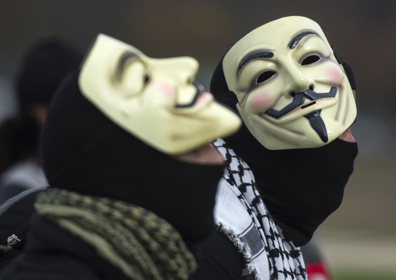 Demonstrators wearing Guy Fawkes masks prepare to march in the Million Mask March, an anti-establishment protest expected to take part today in over 670 cities worldwide, in Washington, D.C. on November 5, 2015. The march, allegedly organized by Anonymous, the “hacktivist” group linked to cyber-attacks against governments and multi-national corporations, aims at protesting government overreach and corporate greed, among other grievances. Photo by Kevin Dietsch/UPI