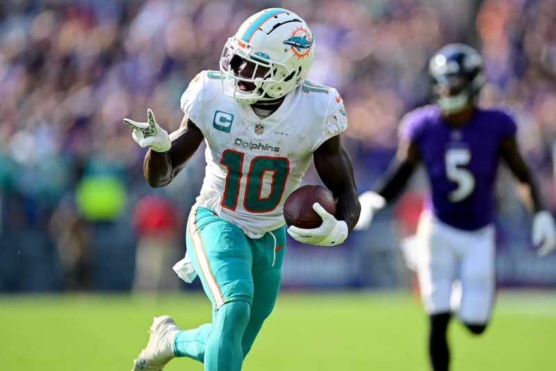 Miami Dolphins wide receiver Tyreek Hill (10) runs past Baltimore Ravens cornerback Jalyn Armour-Davis on a 48-yard reception for a touchdown Sunday at M&ampT Bank Stadium in Baltimore. Photo by David Tulis/UPI | <a href="/News_Photos/lp/d4a46d1a47a9d55705caddda54deea03/" target="_blank">License Photo</a>