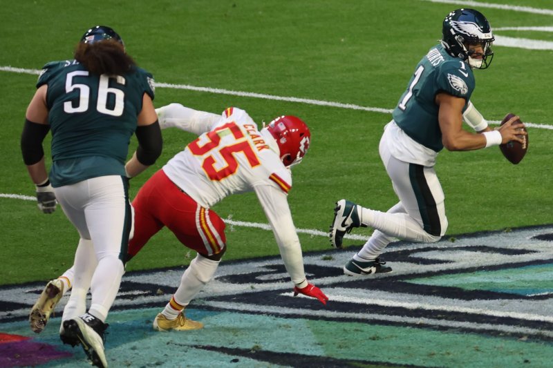 Kansas City Chiefs defensive end Frank Clark (55) slips while chasing Philadelphia Eagles quarterback Jalen Hurts (1) in the second quarter of Super Bowl LVII on Sunday at State Farm Stadium in Glendale, Ariz. Photo by Aaron Josefczyk/UPI