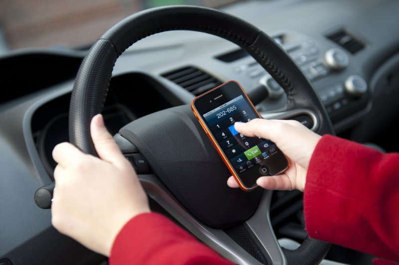 States with comprehensive bans on cellphone use while driving saw a 7% drop in driver deaths over a 17-year period, according to a new study. File photo by Kevin Dietsch/UPI