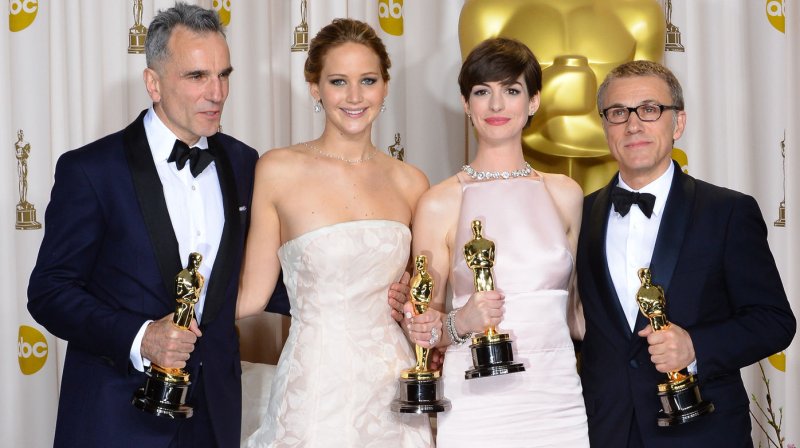 (L-R) Actor Daniel Day-Lewis, actress Jennifer Lawrence, actress Anne Hathaway and actor Christoph Waltz hold their Oscars backstage at the 85th Academy Awards at the Hollywood and Highland Center in the Hollywood section of Los Angeles on February 24, 2013. UPI/Jim Ruymen | <a href="/News_Photos/lp/7810a277939aafd815008c3552b1f5e2/" target="_blank">License Photo</a>
