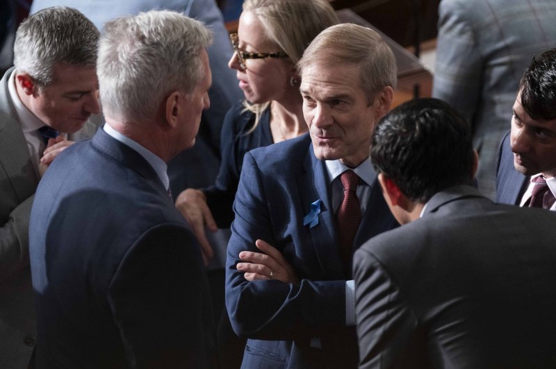 Rep. Jim Jordan (C), R-Ohio, the current Republican nominee for speaker of the House, speaks with former speaker and current Rep. Kevin McCarthy, R-Calif. (L), and others after a second failed vote to elect a new speaker at the U.S. Capitol in Washington, D.C., on Wednesday. Jordan failed to win the speakership on second ballot after 22 fellow Republicans voted against him. Photo by Bonnie Cash/UPI