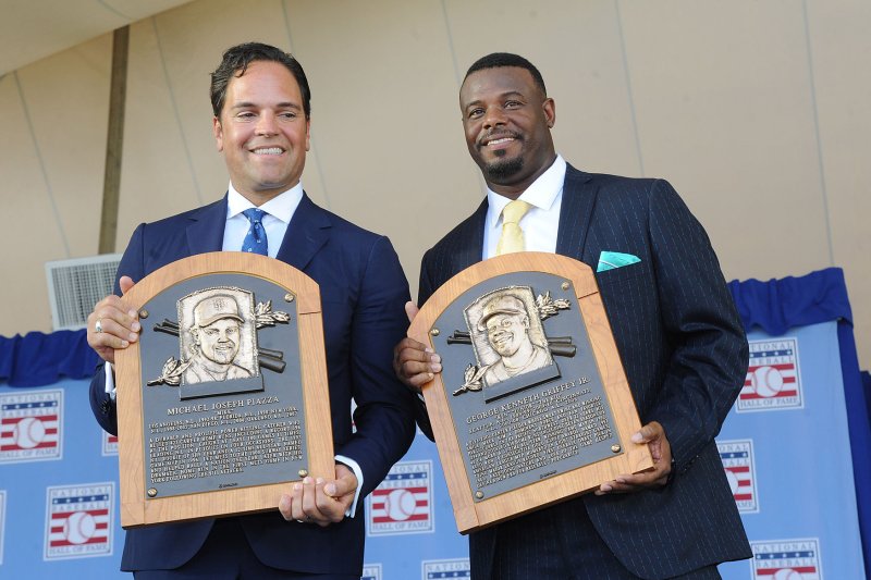 Seattle Mariners center fielder Ken Griffey Jr. and New York Mets catcher Mike Piazza hold their plaquesat the Baseball Hall of Fame induction ceremony in Cooperstown, NY on July 24, 2016. Griffey Jr. and Piazza, the newest members of the National Baseball Hall of Fame, took their permanent place in Cooperstown on Sunday highlighting four days of celebratory events and programs for baseball fans of all ages as part of Hall of Fame Weekend 2016. Photo by George Napolitano/UPI