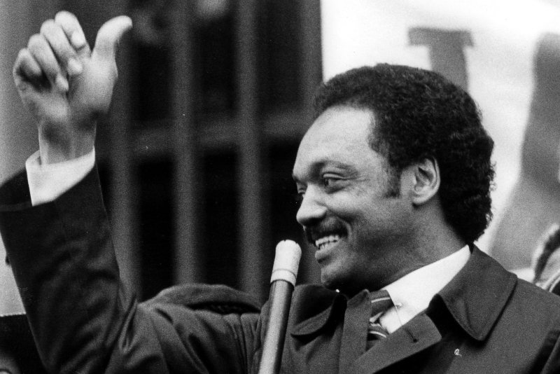 Rev. Jesse Jackson gives the "thumbs-up" sign on his arrival in Philadelphia in April 1984 for the start of the Pennsylvania Presidential primary. File Photo by Mike Feldman/UPI
