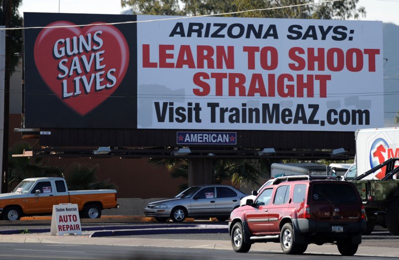 A billboard along 32nd Street in Phoenix is an indication of the attitudes of Arizona residents on gun rights, people of Arizona are allowed to carry guns into bars, January 10,2011. UPI/Art Foxall