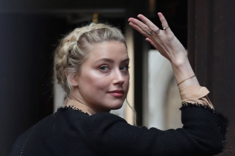 Actress Amber Heard arrives at London's High Court, where she is giving evidence as a defense witness in the Johnny Depp libel trial against "The Sun" newspaper in July 22, 2020. She said in an interview Monday she did not blame the jury for losing a defamation lawsuit in the United States to Depp. File Photo by Hugo Philpott/UPI | <a href="/News_Photos/lp/455ec1921df2268beb5d28a60652b099/" target="_blank">License Photo</a>