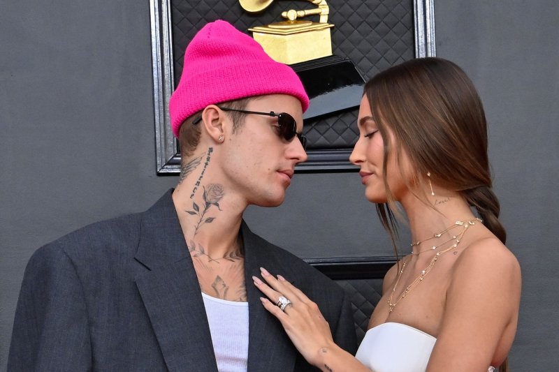 Justin Bieber (L), pictured with Hailey Bieber, returned to the stage after postponing his "Justice" world tour due to his Ramsay Hunt syndrome diagnosis. File Photo by Jim Ruymen/UPI | <a href="/News_Photos/lp/1ba46f4ac5faace2889230412e2b1a3e/" target="_blank">License Photo</a>