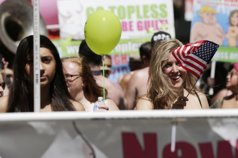 Activists march in the streets toward Bryant Park in New York City on August 25, 2019, at the Go Topless Day Parade, which encouraged women to proudly bare their chests in support of gender equality. File Photo by John Angelillo/UPI | <a href="/News_Photos/lp/10aa8efdb47fba4fb4abea96c8d6139e/" target="_blank">License Photo</a>