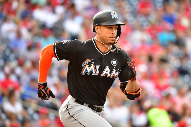 Miami Marlins right fielder Giancarlo Stanton (27) runs to first after grounding out in the 6th inning against the Washington Nationals at Nationals Park in Washington, D.C. on August 30, 2017. File photo by Kevin Dietsch/UPI