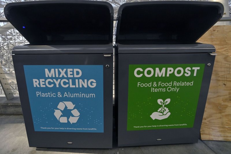 Mixed recycling for plastic and aluminum and compost for food and food related items containers are seen at the SoFi Stadium prior to the LVI Super Bowl game in Inglewood, Calif., on February 12. On Thursday, Gov. Gavin Newsom signed a law requiring all packaging to be recyclable or compostable. File Photo by Jim Ruymen/UPI | <a href="/News_Photos/lp/911d0aad918d0cc8241708e8274f6bcc/" target="_blank">License Photo</a>