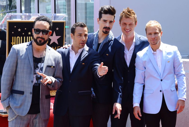 Members of the Backstreet Boys touch their star during an unveiling ceremony honoring them with the 2,495th star on the Hollywood Walk of Fame in Los Angeles on April 22, 2013. The five members celebrating their 20-year career are (L-R) A.J. McLean, Howie Dorough, Kevin Richardson, Nick Carter and Brian Littrell. UPI/Jim Ruymen | <a href="/News_Photos/lp/54e3f552ed861f333d8f4b0de99d35e8/" target="_blank">License Photo</a>