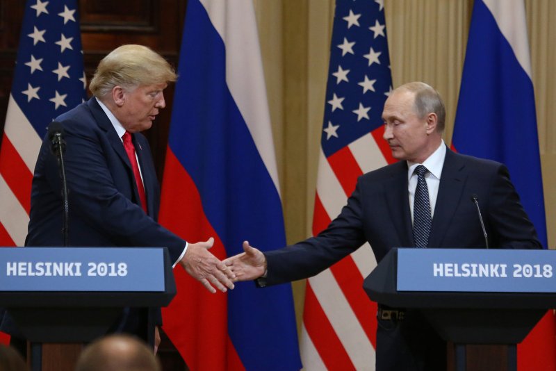 U.S. President Donald Trump (L) shakes hands with Russian President Vladimir Putin during a joint press conference at the Presidential Palace in Helsinki, Finland on July 16. Photo by David Silpa/UPI