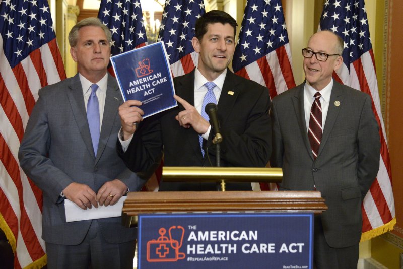 House Speaker Paul Ryan (C) holds a copy of the American Health Care Act passed by Republicans as Majority Leader Kevin McCarthy of California (L) and Oregon Rep. Greg Walden look on, on Capitol Hill, March 7. The bill awaits a review by the Congressional Budget Office before the Senate debates it. File Photo by Mike Theiler/UPI