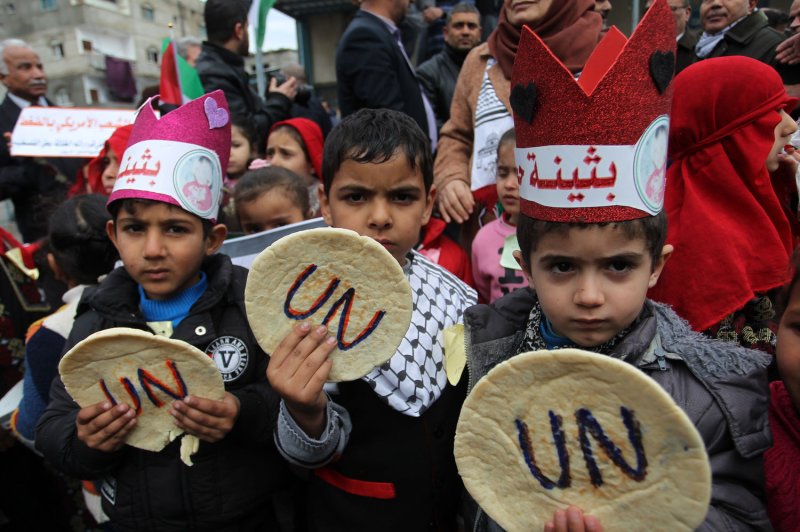 Palestinian children protest against aid cuts outside the United Nations offices in Khan Younis, southern Gaza, on January 28. On Monday, the United Nations said it needs at least $350 million in funding for 2019 after the cuts. File Photo by Ismael Mohamad/UPI