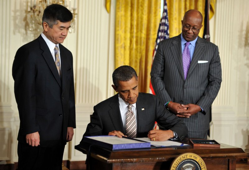 President Barack Obama signs the Manufacturing Enhancement Act in the East Room at the White House in Washington on August 11, 2010. Obama was joined by Secretary of Commerce Gary Locke (L) and United States Trade Representative Ambassador Ron Kirk. UPI/Kevin Dietsch