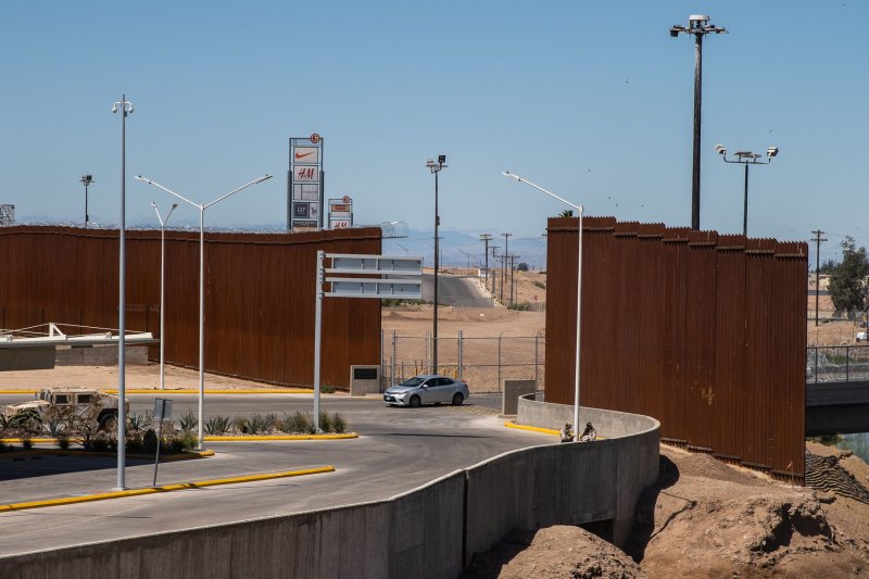 The new barrier (left side) along the border between Calexico, California and Mexicali, Mexico is seen on April 4, 2019. A federal judge on Monday blocked a Trump administration policy forcing asylum seekers to await their court hearings in Mexico. Photo by Ariana Drehsler/UPI