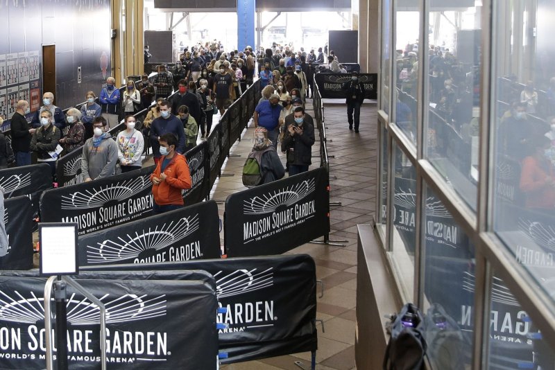 Voters line up at Madison Square Garden to cast their ballots on the first day of early voting for the 2020 election in New York City on October 24, 2020. File Photo by John Angelillo/UPI