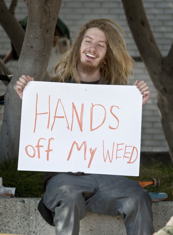 A pro marijuana protester holds a sign as President Barak Obama attends a fund-raising event in San Francisco on October 25, 2011. UPI/Terry Schmitt