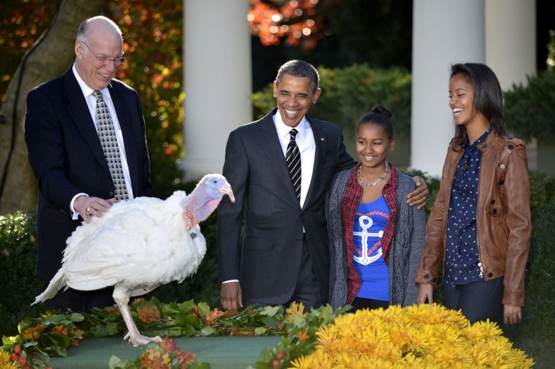 Acting U.S. surgeon general suggests families share medical history. President Barack Obama shares a laugh with his daughters Sasha (R) and Malia as he pardons Cobbler, the National Thanksgiving Turkey, in the Rose Garden at the White House in Washington. UPI/Kevin Dietsch