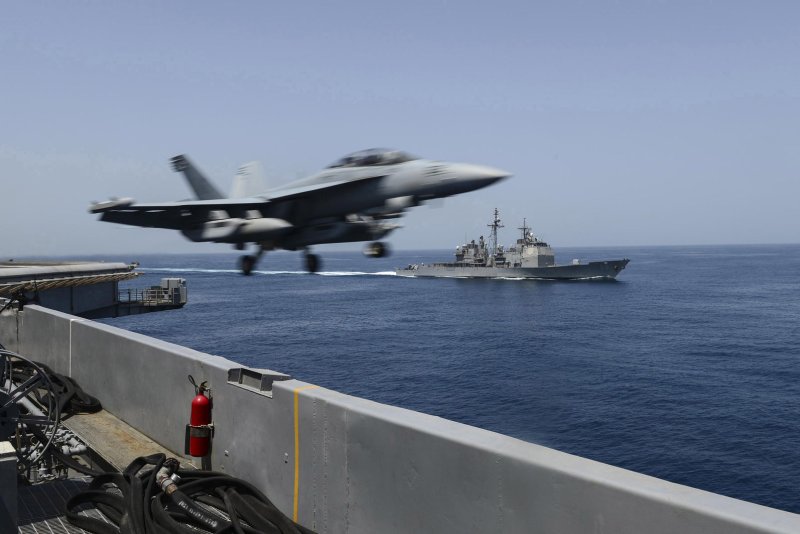 Raytheon hsa reached a $1 billion deal to build next-gen jammers for the Navy's EA-18G Growler fleet. Pictured, a EA-18G launches from the flight deck of the aircraft carrier USS Theodore Roosevelt iin the Arabian Sea, April 21, 2015. U.S. Navy photo by Josh Petrosino/UPI