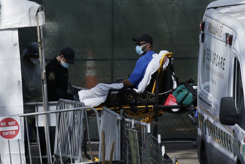 A potential coronavirus patient arrives by ambulance near Mt. Sinai Hospital in New York City on April 1. File Photo by John Angelillo/UPI | <a href="/News_Photos/lp/407a8ba08dc9ac779c9492c84fa72ffd/" target="_blank">License Photo</a>