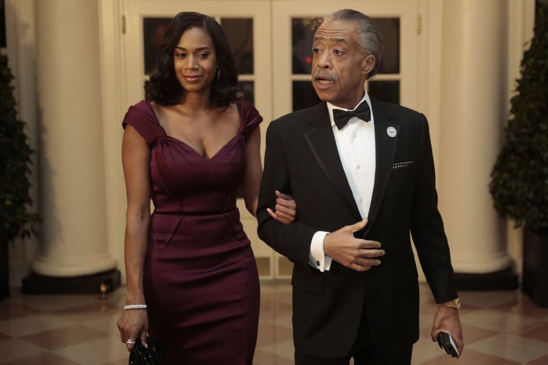 Reverend Al Sharpton, right, and Aisha I. McShaw arrive at a state dinner hosted by U.S. President Barack Obama and U.S. First Lady Michelle Obama in honor of French President Francois Hollande at the White House in Washington, D.C. on February 11, 2014. Obama and Hollande said the U.S. and France are embarking on a new, elevated level of cooperation as they confront global security threats in Syria and Iran, deal with climate change and expand economic cooperation. UPI/Andrew Harrer/Pool