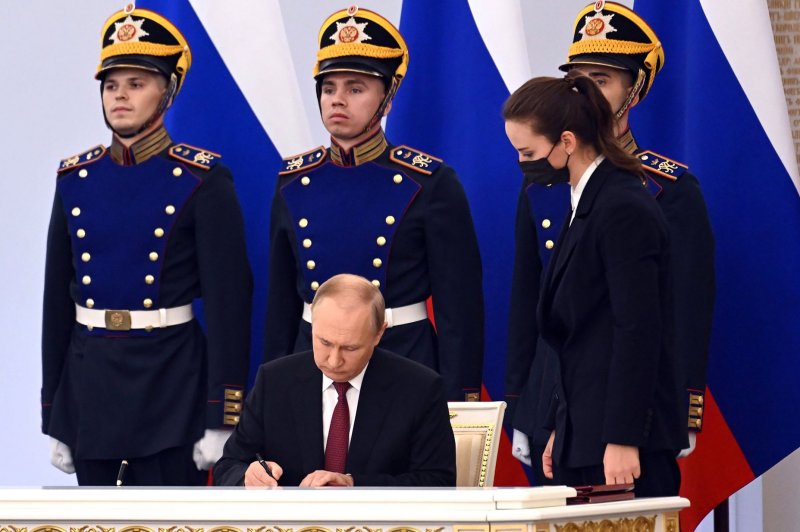 Russian President Vladimir Putin signs documents formally annexing four regions of Ukraine on Friday. Photo courtesy of Kremlin Pool | <a href="/News_Photos/lp/f02a7f2ee15ddcf5590f29c400b2fc14/" target="_blank">License Photo</a>