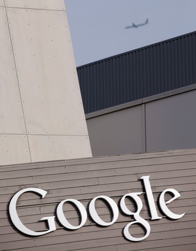 An airplane passes over the Google sign at Google headquarters in Mountain View, California on January 5, 2010. UPI/Mohammad Kheirkhah