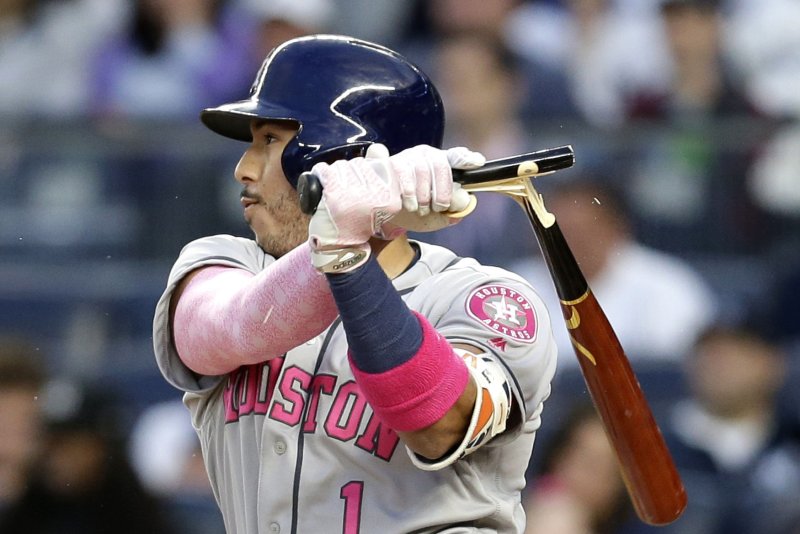 Houston Astros' Carlos Correa breaks his bat in the first inning against the New York Yankees at Yankee Stadium in New York City. File photo by John Angelillo/UPI