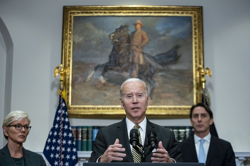 President Joe Biden Wednesday announced $2.8 billion in Energy Department grants from the Bipartisan Infrastructure law to EV battery makers in 12 states. Looking on are Energy Secretary Jennifer Granholm (L) and Senior Energy Security Advisor for the State Department Amos Hochstein (R). Photo by Al Drago/UPI