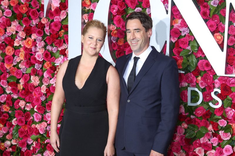 Amy Schumer expecting first child with husband Chris Fischer