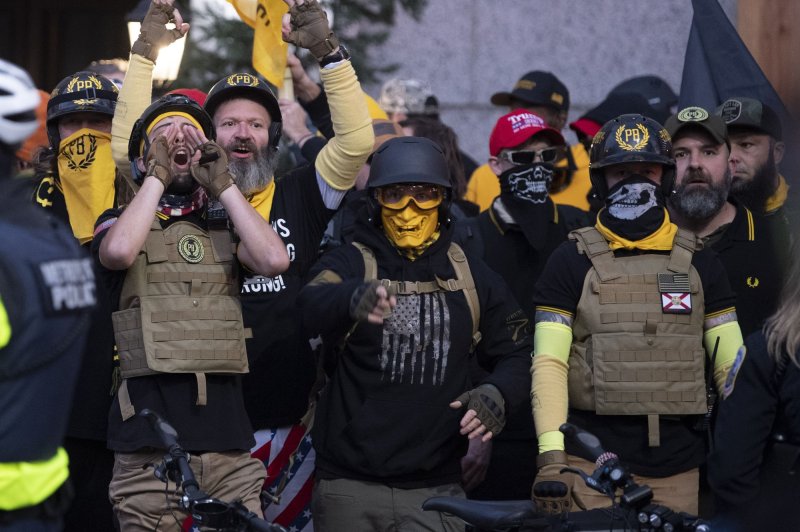 Members of far-right group the Proud Boys yell at counterprotesters at a pro-Trump rally in Washington, D.C., on December 12.&nbsp;The group's leader, 'Enrique' Tarrio was ordered to appear in court Feb. 22. File Photo by Kevin Dietsch/UPI