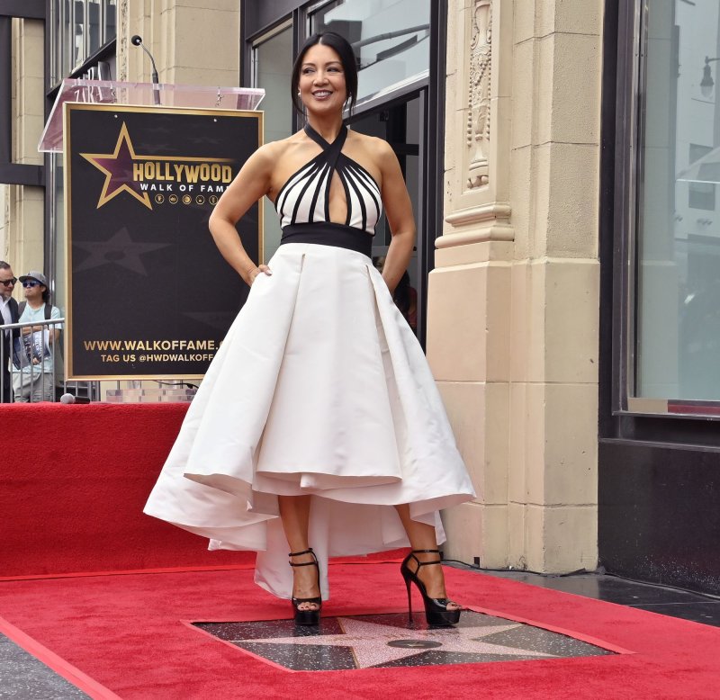 Ming-Na Wen stands atop her star during an unveiling ceremony honoring her with the 2,757th star on the Hollywood Walk of Fame on May 30. The actor turns 60 on November 20. File Photo by Jim Ruymen/UPI