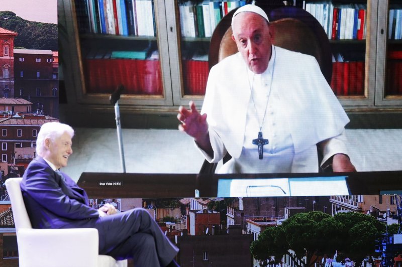 Former President of the United States Bill Clinton speaks with His Holiness Pope Francis remotely Monday at the Clinton Global Initiative 2023 in New York City, as the pope urged unity in the world to tackle climate change "before it's too late." Photo by John Angelillo/UPI