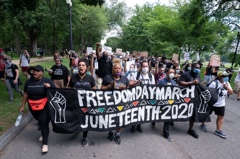 Demonstrators take part in a Juneteenth rally near the Lincoln Memorial on June 19 in Washington, D.C. The House is expected to vote Wednesday on legislation making Juneteenth a federal holiday. File Photo by Kevin Dietsch/UPI