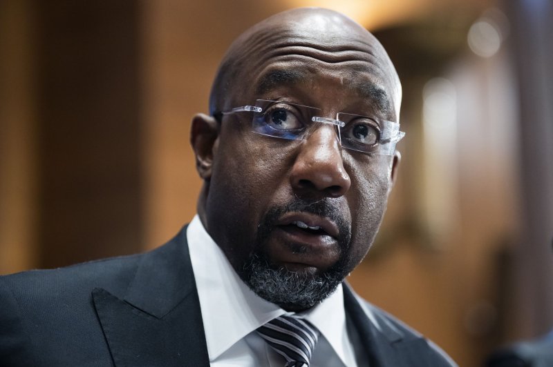 Sen. Raphael Warnock, D-Ga., questions Federal Reserve Chairman Jerome Powell during the Senate Banking Committee hearing at a Senate Banking, Housing, and Urban Affairs Committee hearing in March. File Photo by Tom Williams/UPI