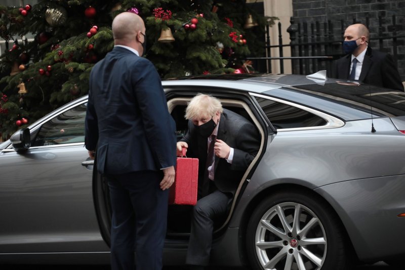 British Prime Minister Boris Johnson returns to No.10 Downing St. on Wednesday after visiting British lawmakers who signed the Brexit trade deal with the EU. Photo by Hugo Philpott/UPI