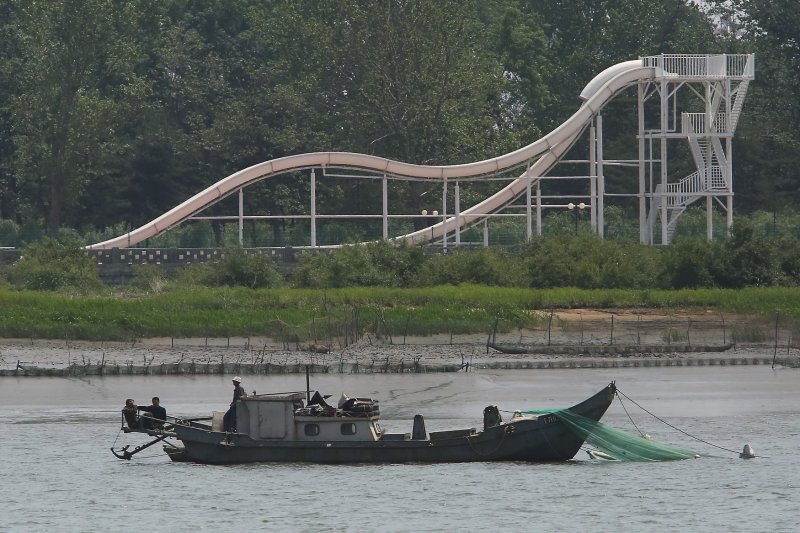 A North Korean boat fishes off the banks of the North Korean city Sinuiju, across the Yalu River from Dandong, China's largest border city with North Korea. North Korean fishing boats, 16 in total and carrying 27 dead bodies, have been discovered near Japan's coast since October. File Photo by Stephen Shaver/UPI