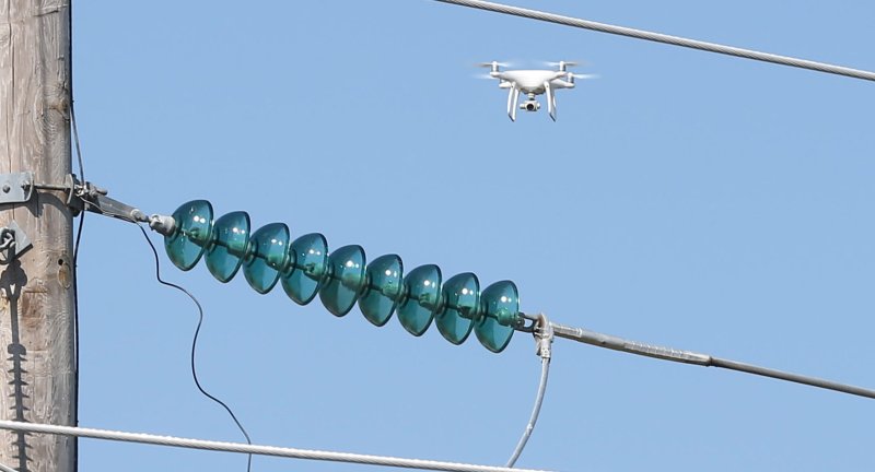 A drone flies over equipment at a Ameren Electric Company facility in Belleville, Illinois on September 8. In California, a couple was arrested after allegedly using a drone to deliver drugs. File Photo by Bill Greenblatt/UPI | <a href="/News_Photos/lp/cb5e5af1c14d827939fbff1361e3e27b/" target="_blank">License Photo</a>