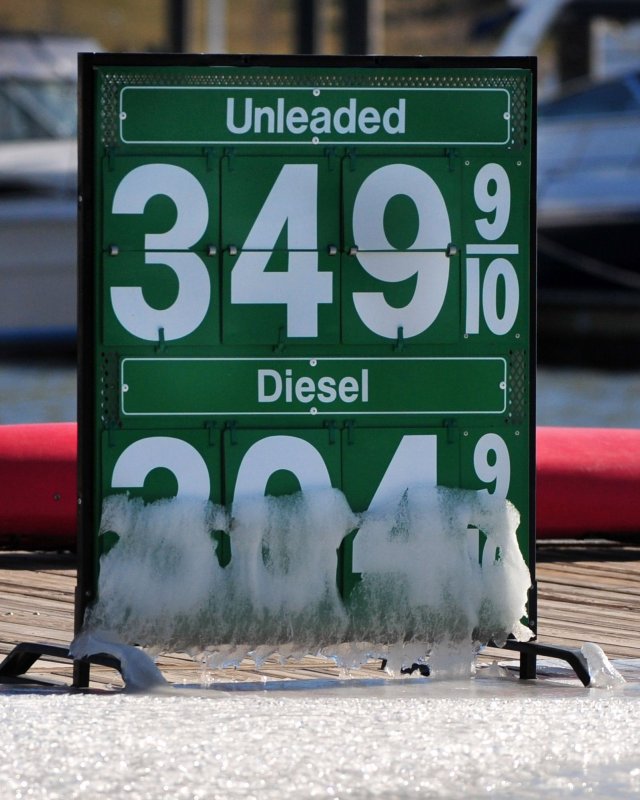A sign displaying gas prices covered in ice is seen at the National Harbor in Maryland on December 24, 2010. The national average price for a gallon of gas is above $3 for the first time since 2008 and is the highest ever for the holiday season. UPI/Kevin Dietsch | <a href="/News_Photos/lp/8abbb075cfd45b121632b3c89a98935e/" target="_blank">License Photo</a>