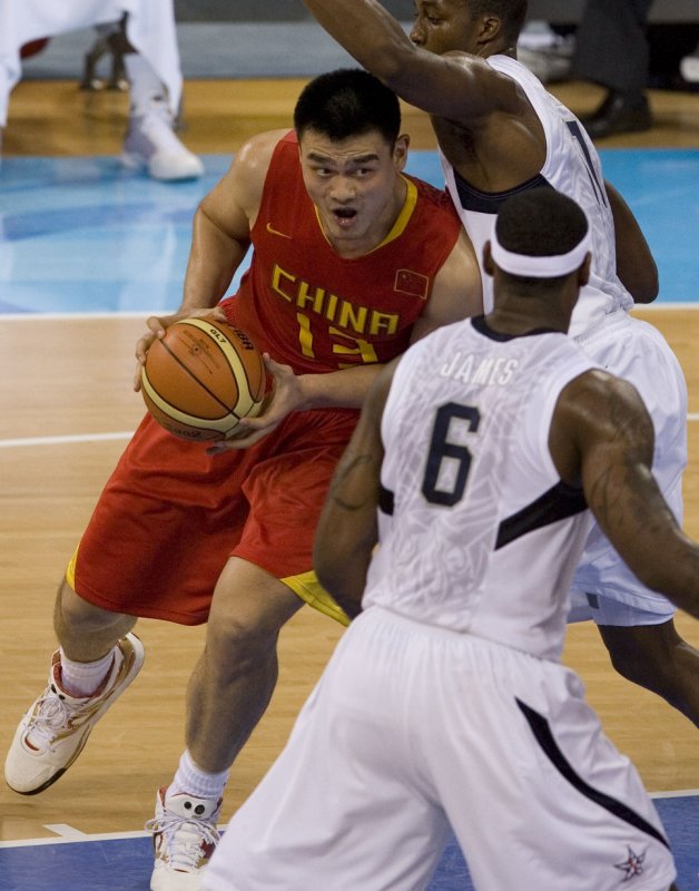 USA's James Lebron (Front) and Kobe Bryant try to guard China's Yao Ming (L) during their game in the preliminary round of the men's Olympic basketball competition in Beijing on August 10, 2008. USA won 101-70. (UPI Photo/Stephen Shaver)