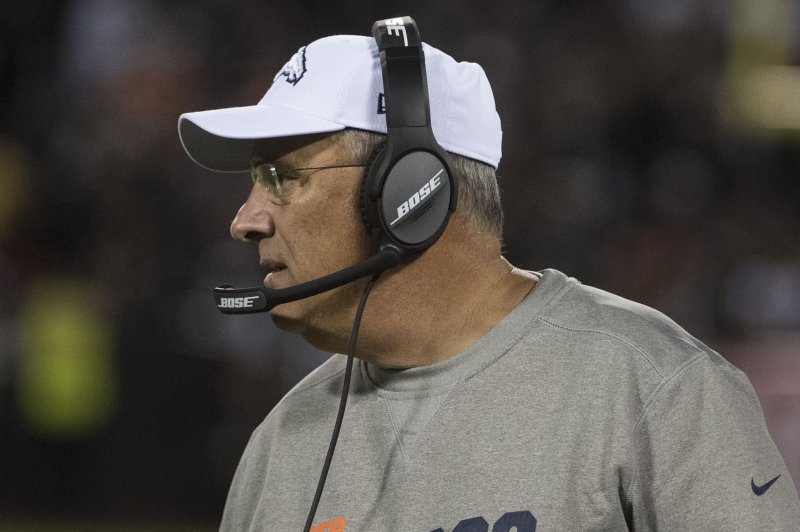 Former Denver Broncos head coach Vic Fangio (pictured) will join head coach Mike McDaniel's Miami Dolphins coaching staff. File Photo by Terry Schmitt/UPI