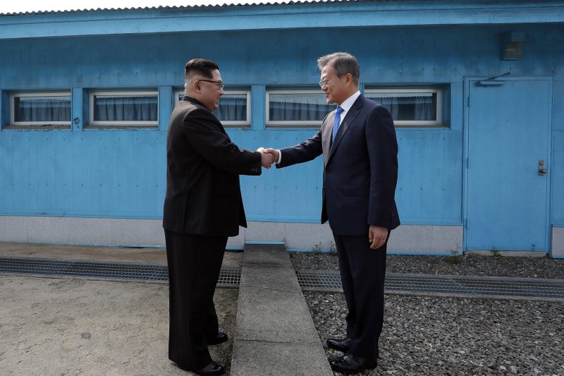 Seoul and Pyongyang restored communications hotlines on Monday, both governments reported, the latest in calls from both North Korean leader Kim Jong Un (left) and South Korean President Moon Jae-in (right) to improve relations on the Korean Peninsula. File photo by Inter-Korean Summit Press Corps/UPI