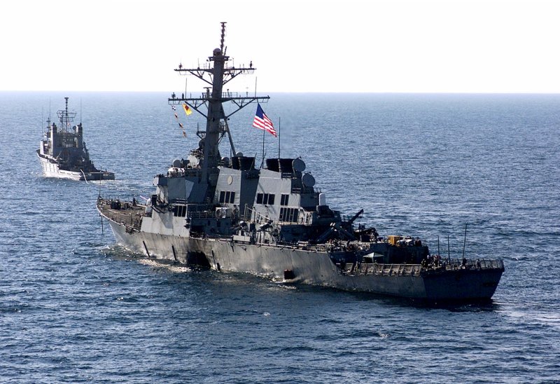 The U.S. Navy destroyer USS Cole is towed away from the port city of Aden, Yemen, into open sea by the Military Sealift Command ocean-going tug USNS Catawba. On October 12, 2000, 17 sailors were killed and 39 were injured in an explosion that occurred as it was being refueled. File Photo by Don L. Maes/U.S. Navy | <a href="/News_Photos/lp/cc235fedbb6537289e5153d7c0197d78/" target="_blank">License Photo</a>