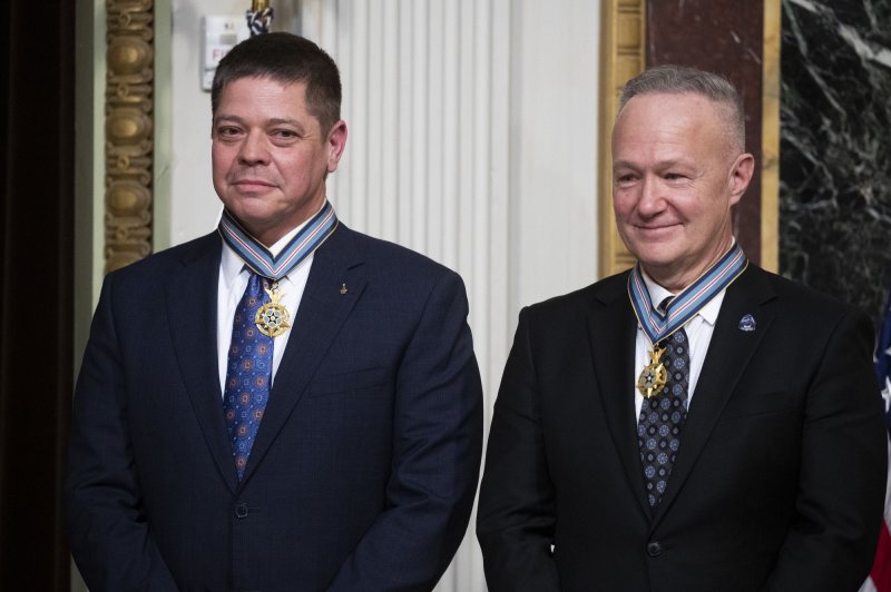 Former NASA astronauts, Robert Behnken (L) and Douglas Hurley (R), are awarded the Congressional Space Medal of Honor during a ceremony hosted by U.S. Vice President Kamala Harris Tuesday. Photo by Michael Reynolds/UPI