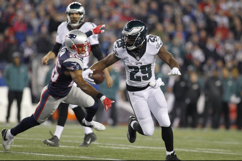 Philadelphia Eagles running back DeMarco Murray (29) dodges a tackle by New England Patriots cornerback Logan Ryan (26) in the fourth quarter at Gillette Stadium in Foxborough, Massachusetts on December 6, 2015. The Eagles defeated the Patriots 35-28. Photo by Matthew Healey/ UPI