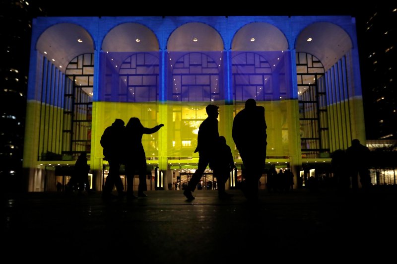 People arrive at Lincoln Center's Metropolitan Opera displaying the Ukrainian national flag colors for 'A Concert of Remembrance and Hope' for Ukraine in February in New York City. File Photo by Peter Foley/UPI